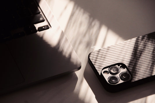 A laptop computer sitting on top of a white table