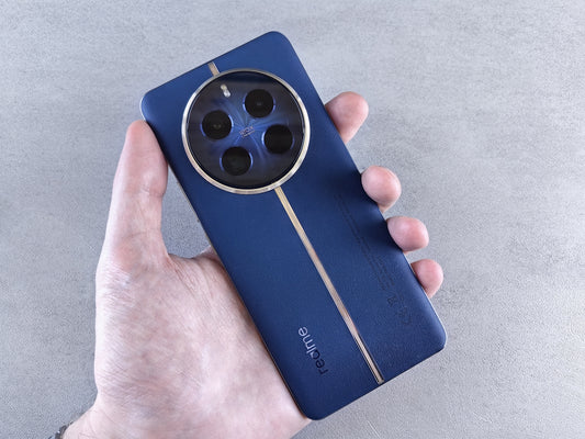 Hand holding a blue smartphone with circular camera lens.