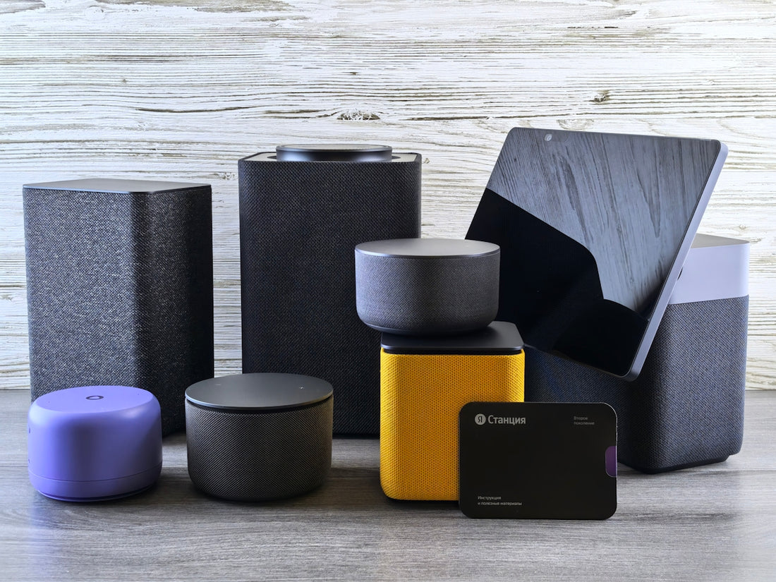 Collection of modern electronic devices and speakers.