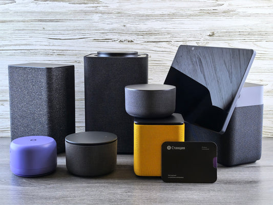 Collection of modern electronic devices and speakers.